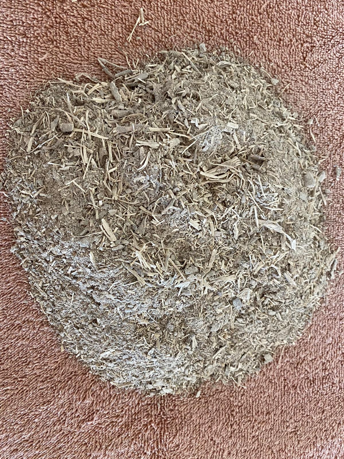 Pounded kava root with visible fibres and chips
